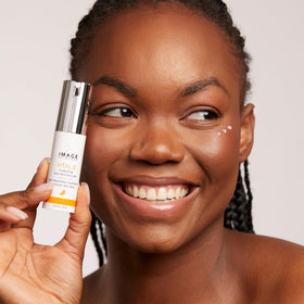 IMAGE Skincare pump dispensing gel showing controlled, hygienic application