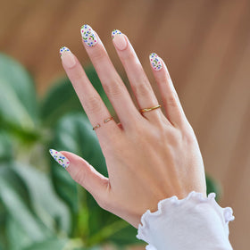 imPRESS macro of 3D pearl accent on nail highlighting decorative texture and visual depth