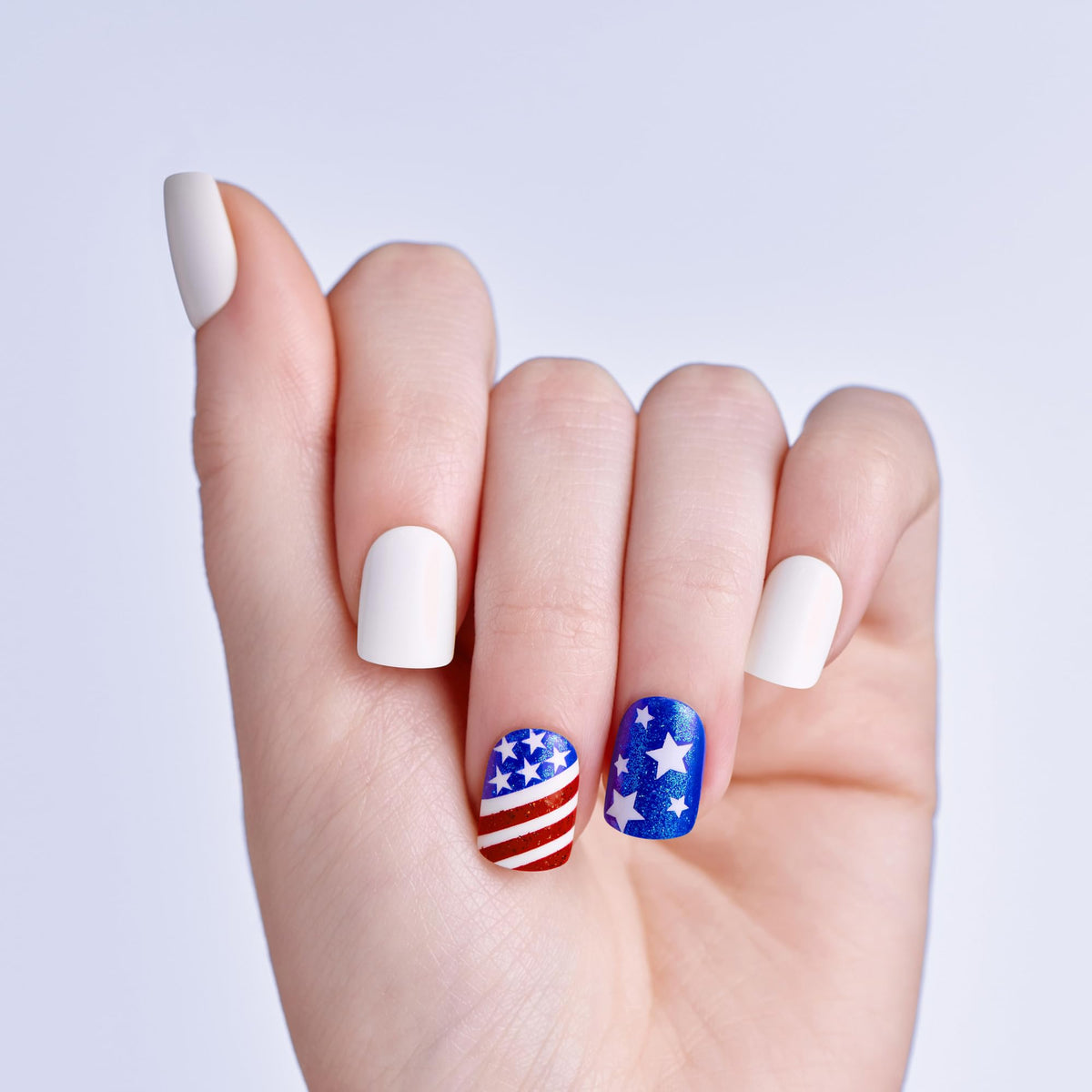 imPRESS close-up of stars and stripes nail art showcasing vibrant colors