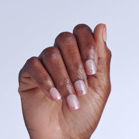 imPRESS close-up of nail row showing pink white tips, highlights glossy finish