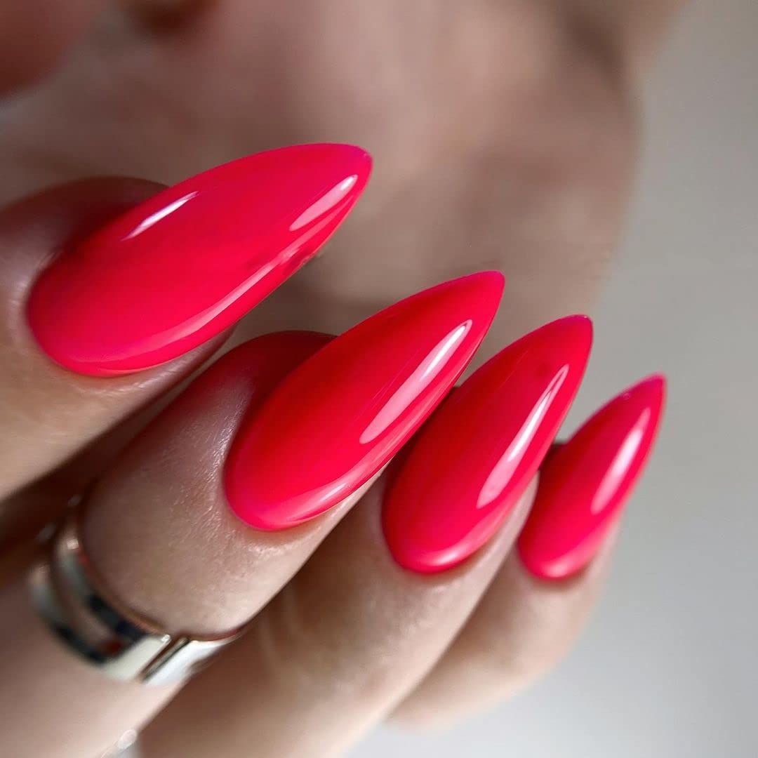IN.HYPE neon pink manicure on hand showcasing vibrant long-lasting finish