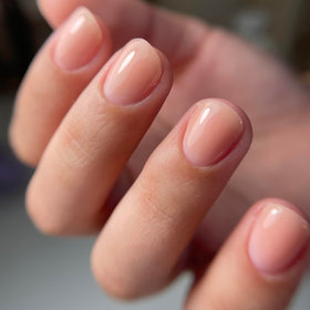 IN.HYPE finished manicure in salon setting showing natural-looking strengthened nails