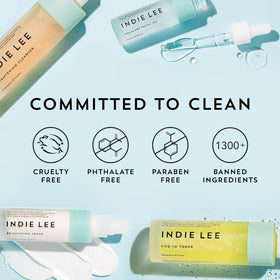 Indie Lee bottle next to a common water glass showing the product size