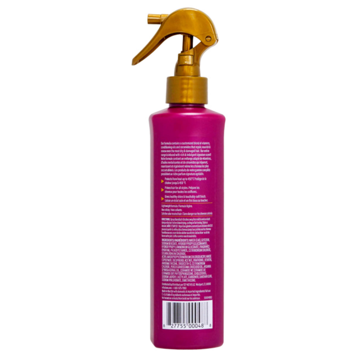 Infusium heat protector being misted on hair mid-lengths to protect and add smoothness during styling