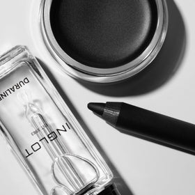 Pot beside a coin for scale showing Inglot compact travel-ready convenience