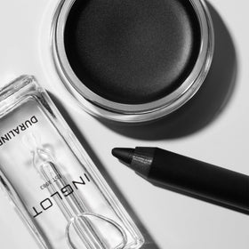 Inglot Duraline next to hand for size scale and professional use