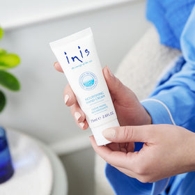 Inis hand cream open cap with cream texture illustrating fast absorption