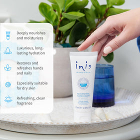 Inis hand cream being applied to palm to show smooth moisturizing action