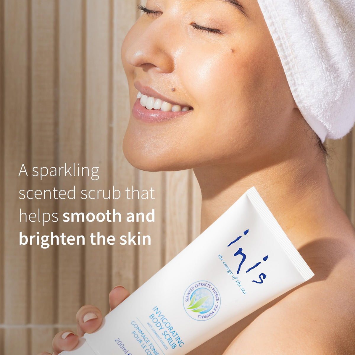 Person using Inis scrub in shower illustrating gentle polish and refreshment benefit