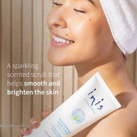 Person using Inis scrub in shower illustrating gentle polish and refreshment benefit