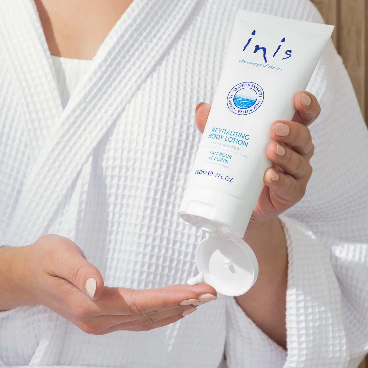 Inis open cap with cream drop showing dispensing ease and creamy formula