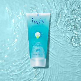 Inis 7 fl oz bottle next to a glass for scale and travel convenience