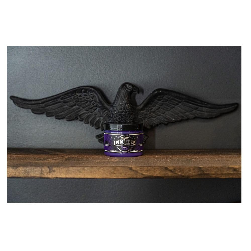 INK-EEZE purple ointment with ingredient elements, highlights essential oils and cruelty-free