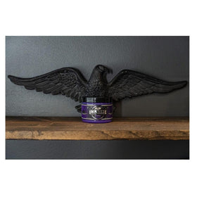 INK-EEZE purple ointment with ingredient elements, highlights essential oils and cruelty-free