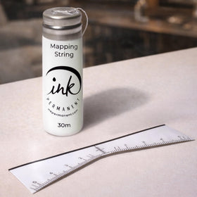 Ink Permanent close-up of pre-inked string showing clear guide line for faster alignment