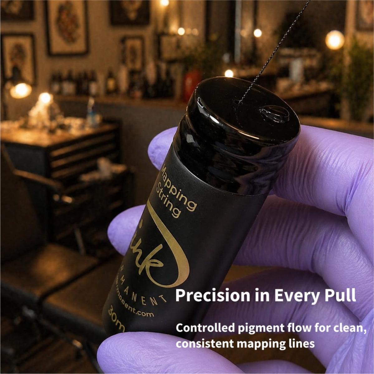 Ink Permanent spool beside ruler for scale, displays 100 ft length convenience
