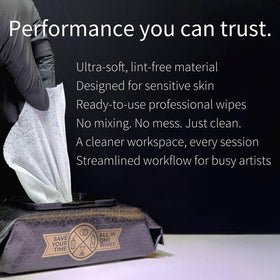 Ink Permanent wipe in hand during tattooing demonstrating easy single-touch use