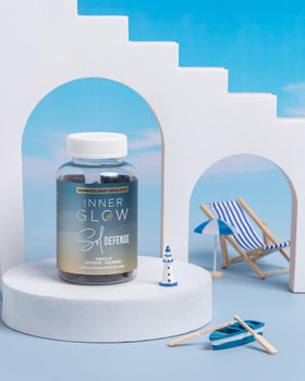 Inner Glow gummy held in hand to show size, clarifies easy-to-take portion benefit