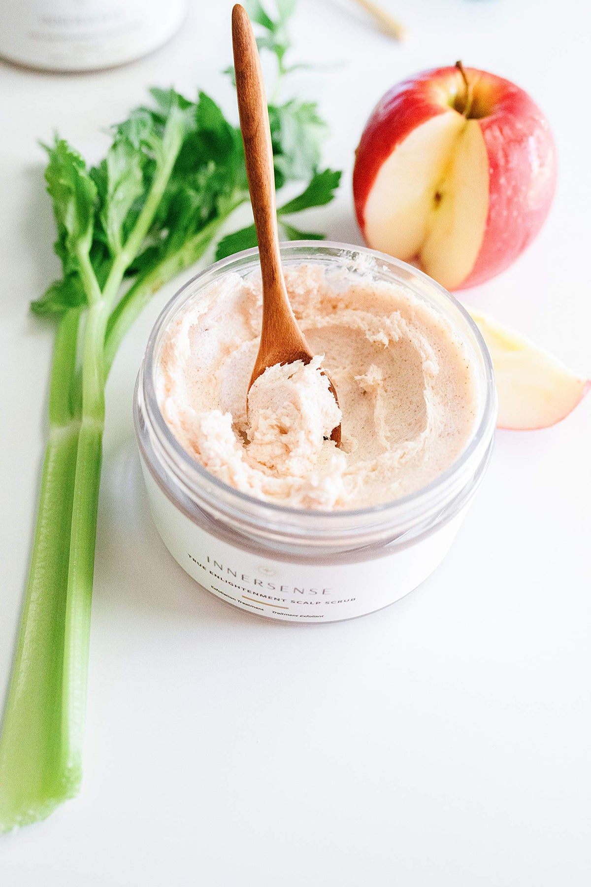 INNERSENSE application in hand massaging scrub into scalp for refreshed feeling