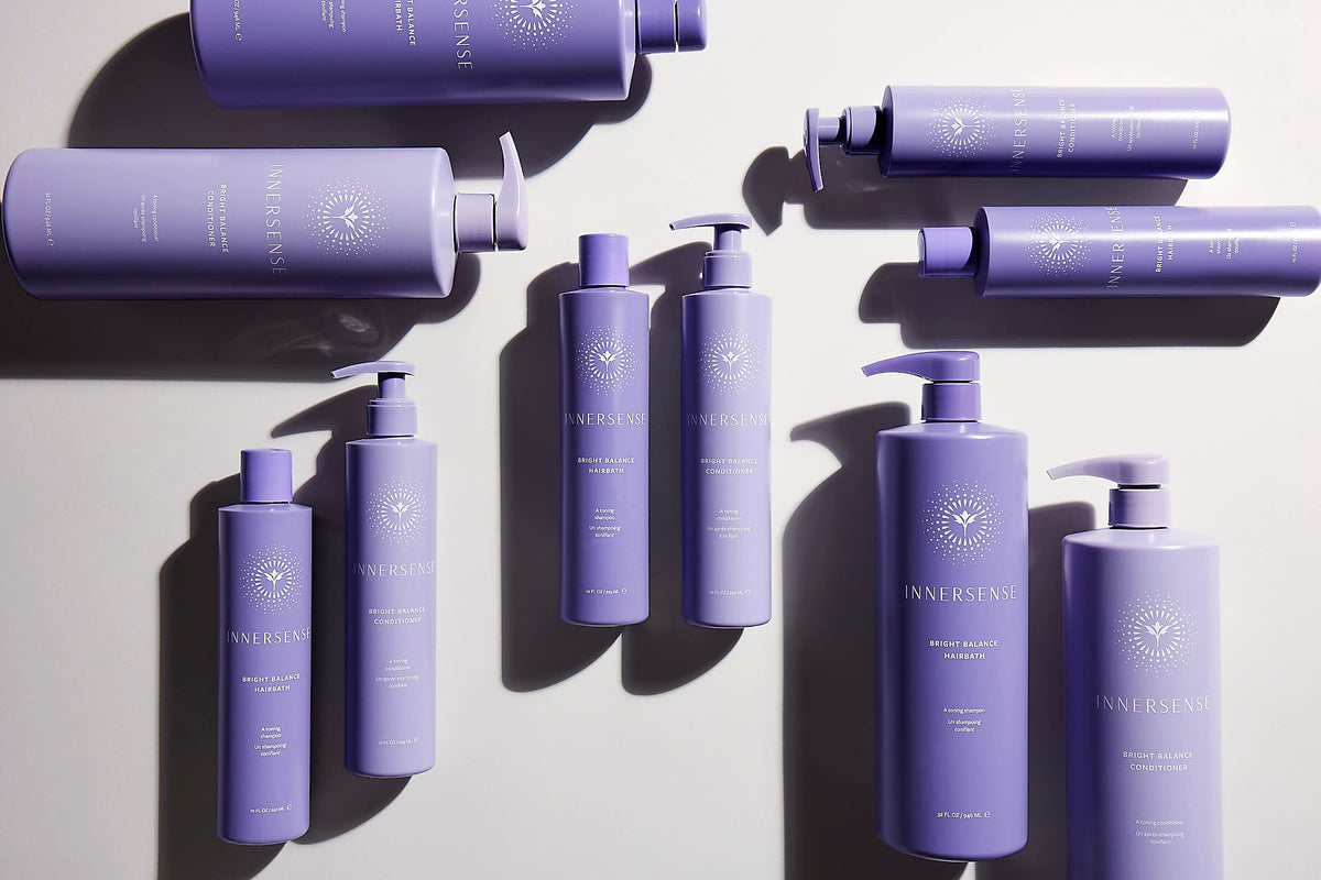 INNERSENSE product being applied to blonde hair to neutralize brass