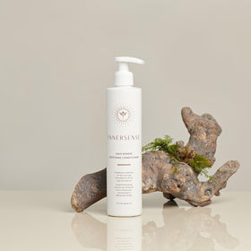 INNERSENSE bottle staged in bathroom with towel, promotes clean sustainable routine