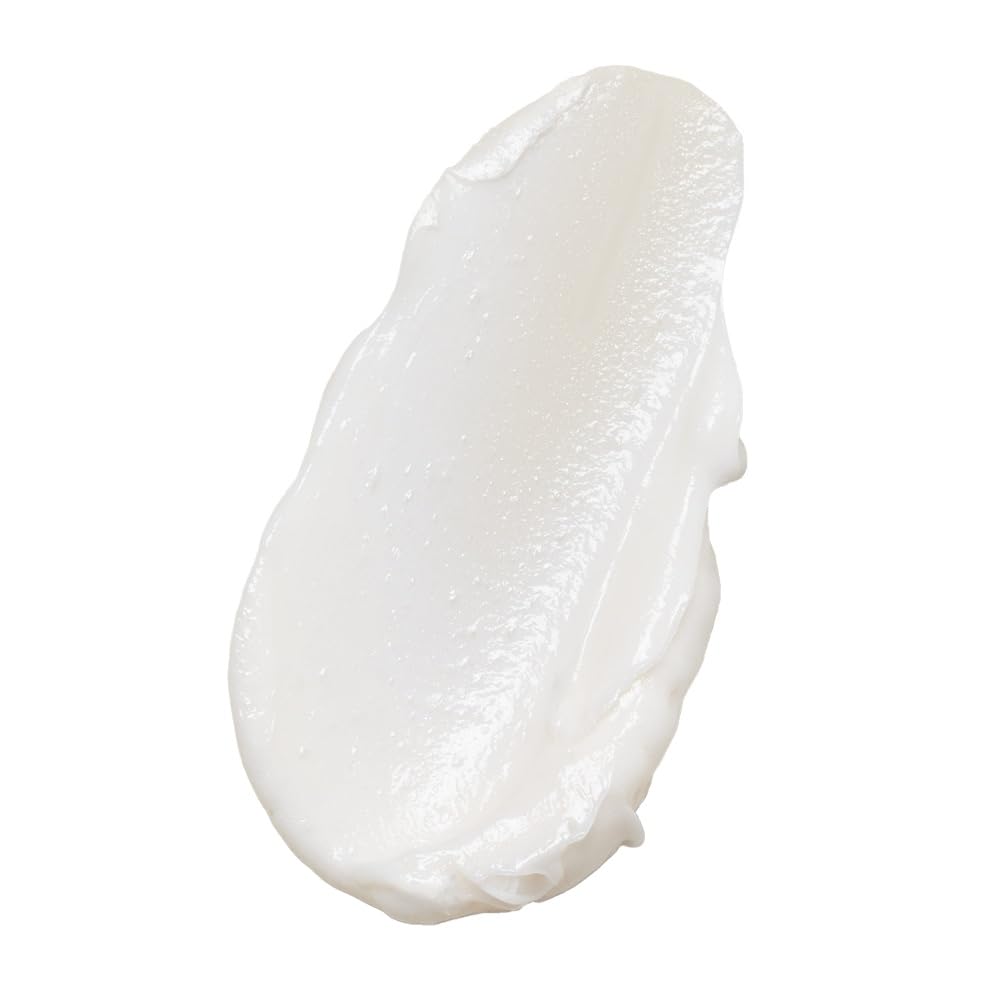 INNERSENSE conditioner texture pouring from bottle, creamy hydration visible