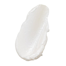 INNERSENSE conditioner texture pouring from bottle, creamy hydration visible
