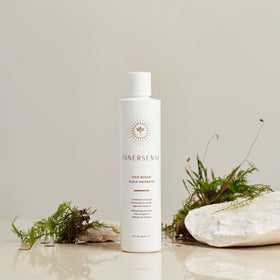 INNERSENSE bottle staged in bathroom setting showing natural ingredients and lifestyle appeal