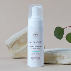 INNERSENSE 6 fl oz bottle beside everyday items for scale