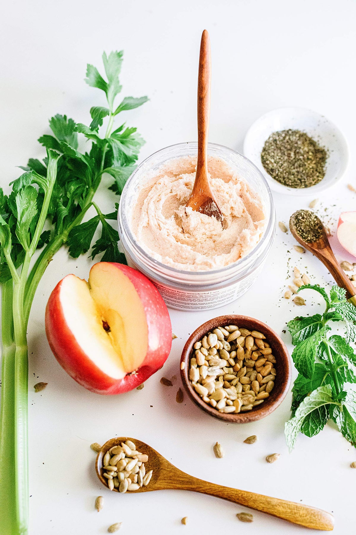 INNERSENSE ingredients flatlay with apple, celery seed, peppermint illustrating natural sourcing