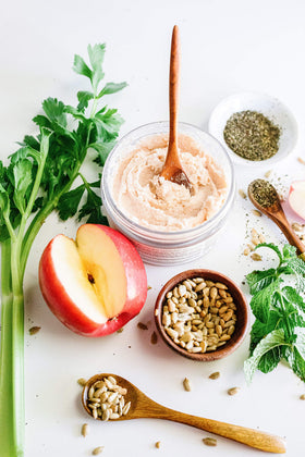 INNERSENSE ingredients flatlay with apple, celery seed, peppermint illustrating natural sourcing
