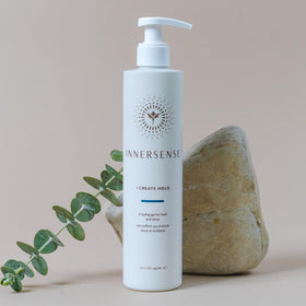 INNERSENSE hand holding 295 ml bottle showing real size and easy use benefit