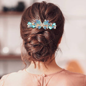 inSowni on model securing half-up hairstyle, provides polished finishing touch