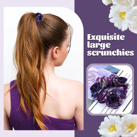 inSowni dark blue scrunchie holding ponytail on model, secure hold with floral finish