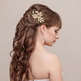 inSowni U-shaped flower pins securing a bridal bun, adding floral accents and stability
