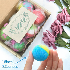 INTEYE bath bomb held in hand for scale, conveying compact 1.8-inch size convenience