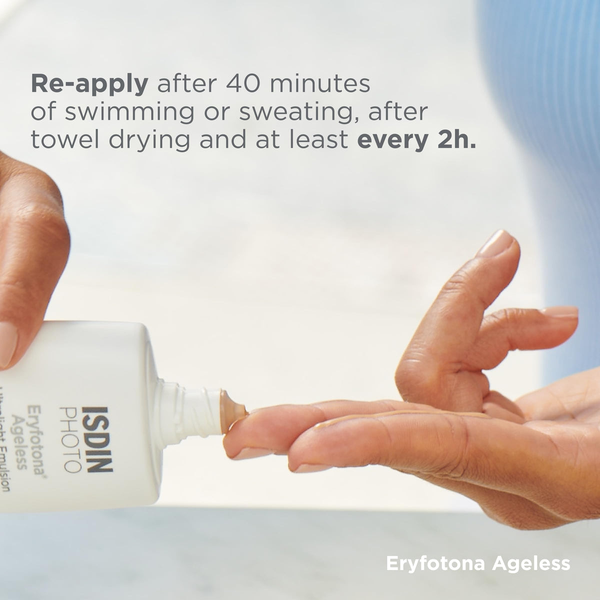 ISDIN Eryfotona beside ruler showing 3.4 fl oz size and scale