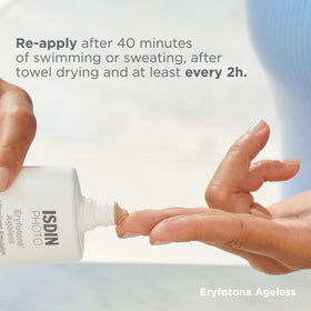 ISDIN Eryfotona beside ruler showing 3.4 fl oz size and scale