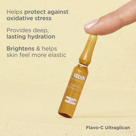 ISDIN opened ampoule being dispensed for easy application