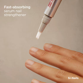 ISDIN Si-Nails serum dropper releasing clear formula for quick absorption