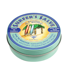 Island Soap & Candle Works tin on beach towel showing protection during outdoor activities