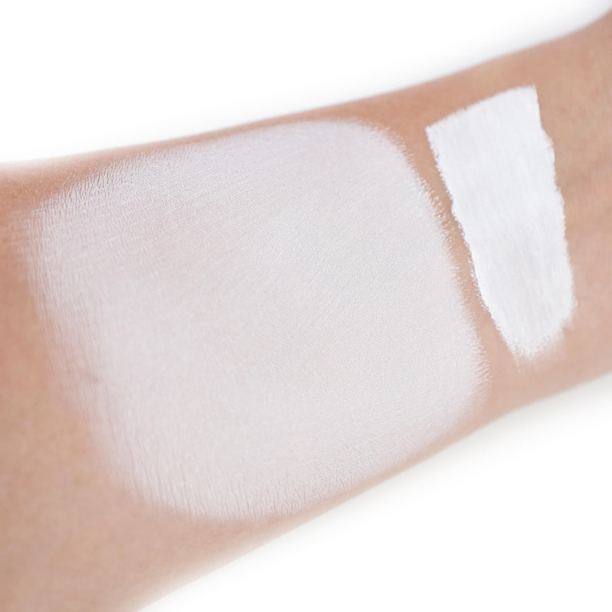 IS'MINE texture close-up of creamy white liquid for smooth blending benefit