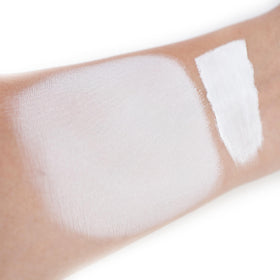 IS'MINE texture close-up of creamy white liquid for smooth blending benefit