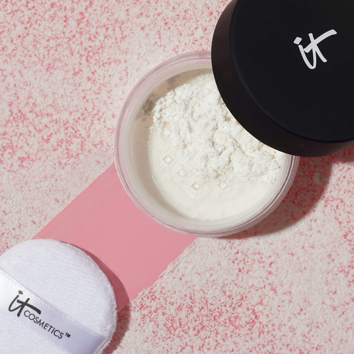 IT Cosmetics jar on vanity with skincare, suggests polished everyday routine