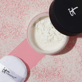 IT Cosmetics jar on vanity with skincare, suggests polished everyday routine