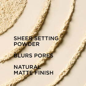 IT Cosmetics powder applied on hand demonstrating pore-blurring benefit
