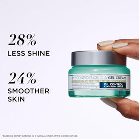 IT Cosmetics jar next to a coin for scale, shows compact 2.0 oz travel-friendly size