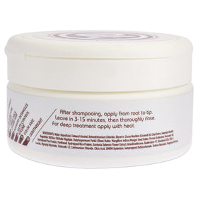 It's a 10 Coily Miracle Hair Mask rich cream texture on fingertip demonstrating slip and intense moisture