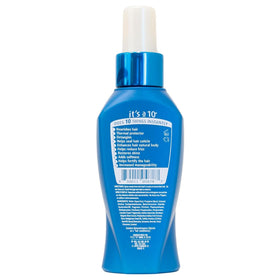 It's A 10 misting onto damp hair, demonstrating easy application and detangling