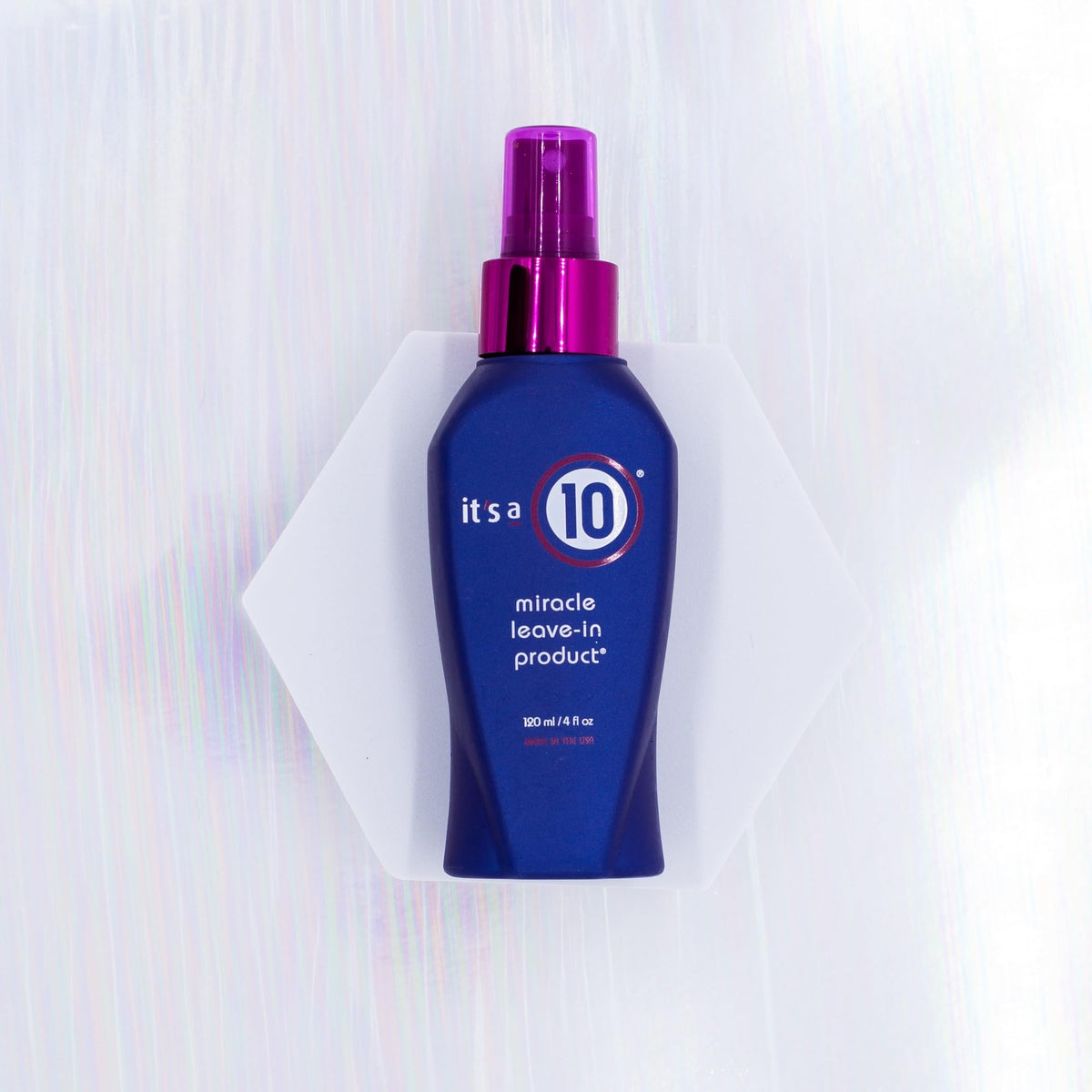 It's A 10 spray nozzle closeup demonstrating even mist application for effortless detangling